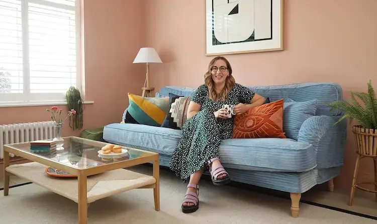 Beth standing at a front door